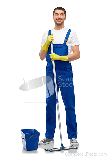 Image of male cleaner cleaning floor with mop and bucket