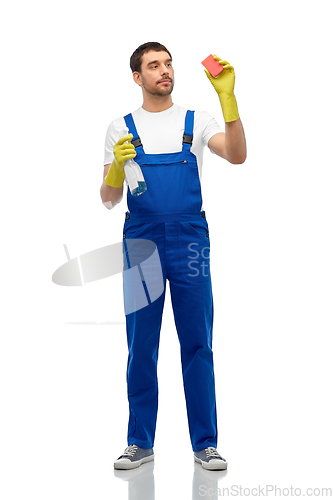 Image of male cleaner cleaning with sponge and detergent