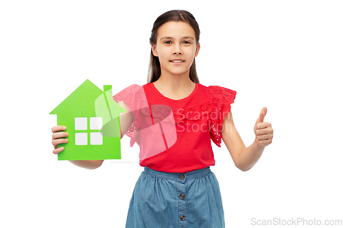 Image of happy girl with green house icon showing thumbs up