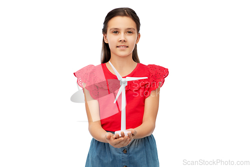 Image of smiling girl with toy wind turbine