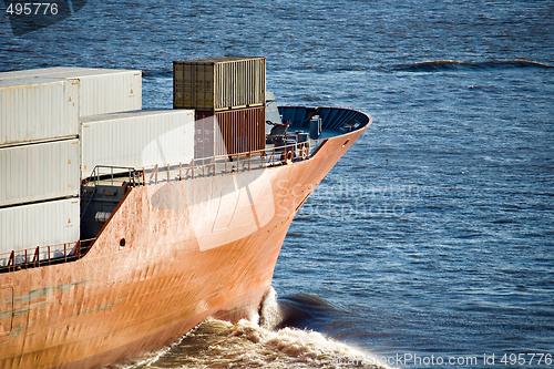 Image of container ship heading out to sea