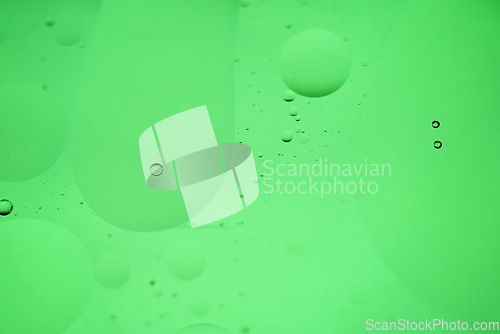 Image of Green mint abstract background picture made with oil, water and soap