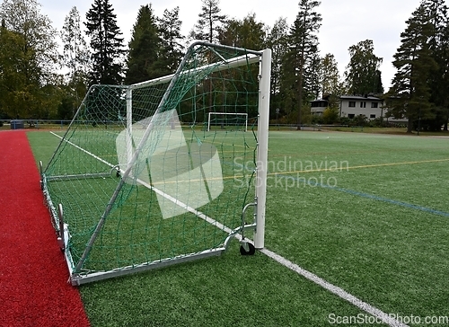 Image of soccerl goal on wheels in a stadium 