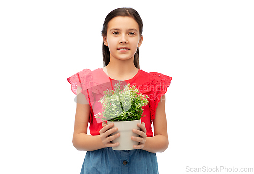 Image of happy smiling girl holding flower in pot