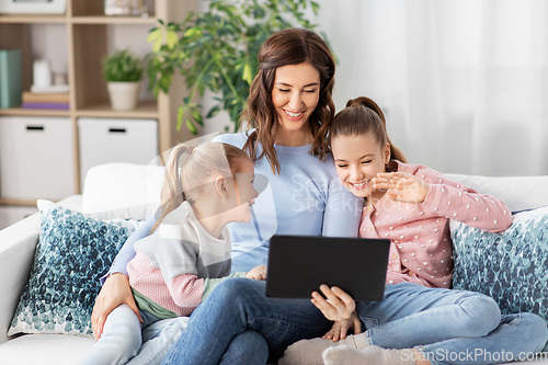 Image of mother and children having video call on tablet pc