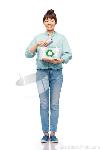 Image of smiling young asian woman sorting metallic waste