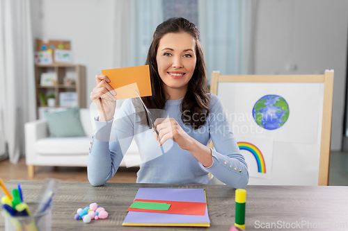 Image of teacher having online class of arts and crafts