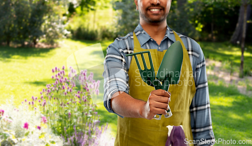 Image of indian gardener or farmer with garden tools