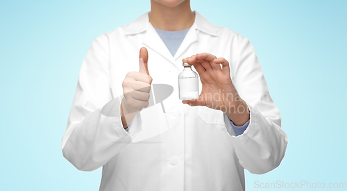 Image of close up of doctor with medicine showing thumbs up