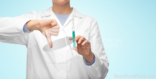 Image of close up of doctor with syringe shows thumbs down