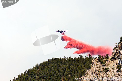 Image of firefighting aircraft dumping retardant