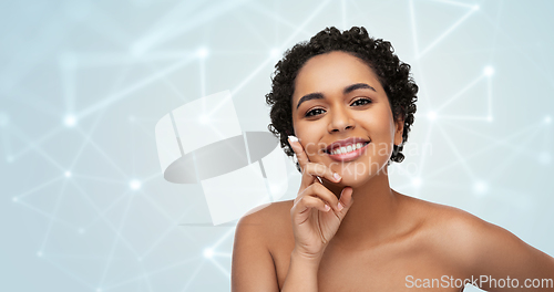 Image of young african american woman with moisturizer