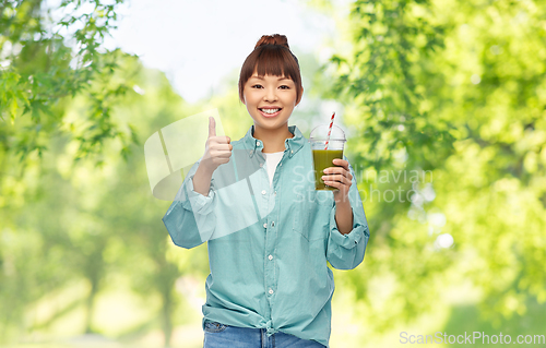 Image of happy smiling asian woman with can drink