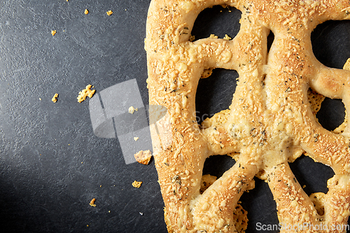 Image of close up of cheese bread on kitchen table