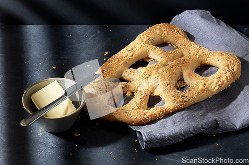 Image of close up of cheese bread, butter and table knife