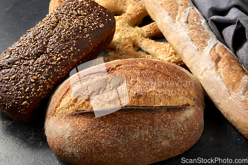 Image of close up of different bread on kitchen towel