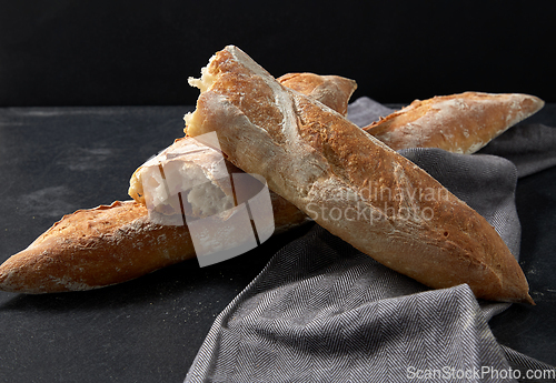 Image of close up of baguette bread on kitchen towel