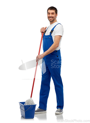 Image of male cleaner cleaning floor with mop and bucket