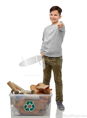 Image of smiling boy sorting paper waste