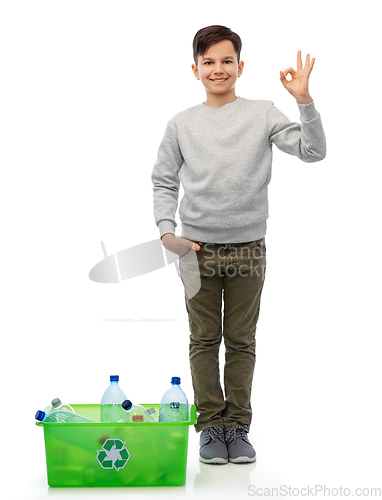 Image of smiling boy sorting plastic waste