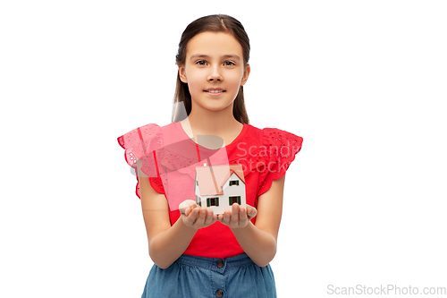 Image of smiling girl holding house model