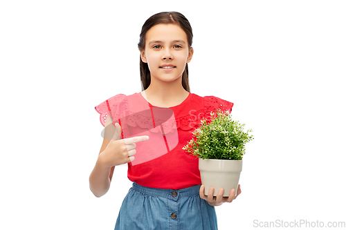 Image of happy smiling girl holding flower in pot