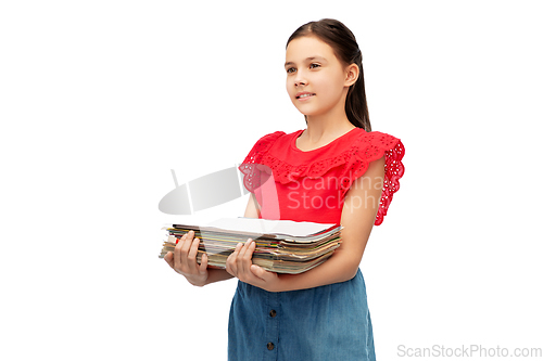 Image of smiling girl with magazines sorting paper waste