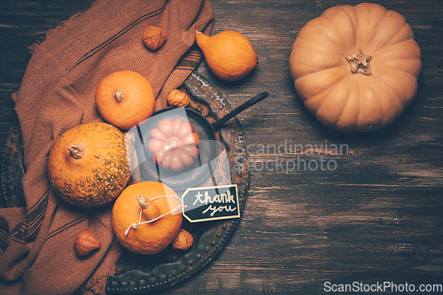 Image of Happy Thanksgiving Day background, wooden table decorated with Pumpkins and Candles