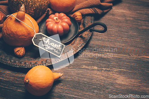 Image of Happy Thanksgiving Day background, wooden table decorated with Pumpkins and Candles