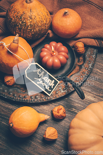 Image of Happy Thanksgiving Day background, wooden table decorated with Pumpkins and Candles