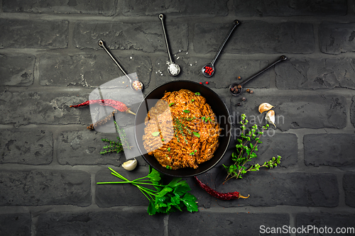 Image of Mince. Marinated Ground meat with ingredients for cooking on black background
