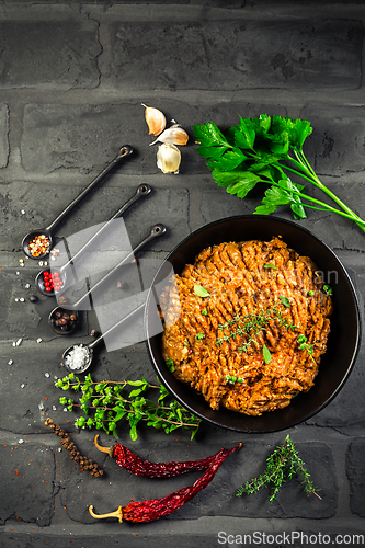 Image of Mince. Marinated Ground meat with ingredients for cooking on black background