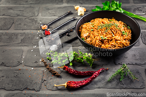 Image of Mince. Marinated Ground meat with ingredients for cooking on black background