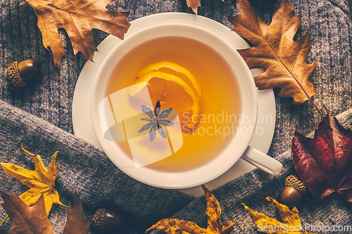 Image of Hot lemon tea for cold  season with warm  sweater and autumn leaves