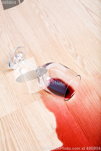 Image of wine glass spill on table