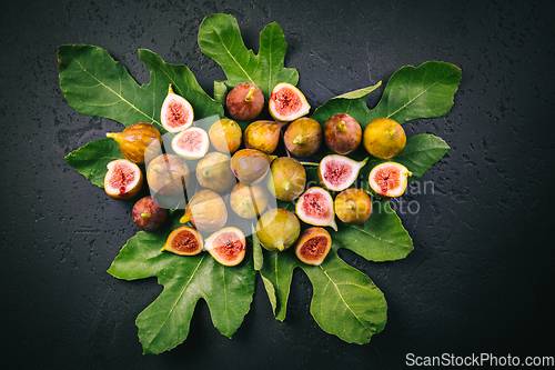 Image of Harvesting - tasty organic figs on black background