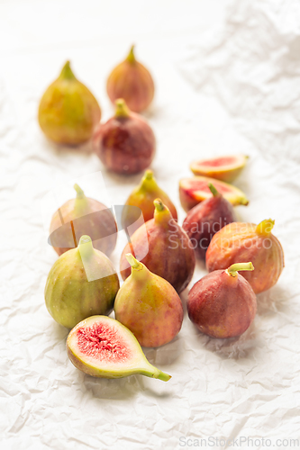 Image of Tasty organic figs on white background