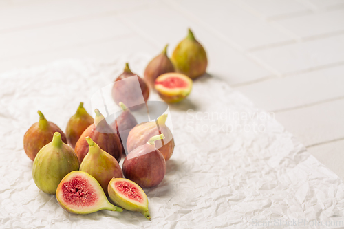 Image of Tasty organic figs on white background