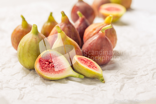 Image of Tasty organic figs on white background