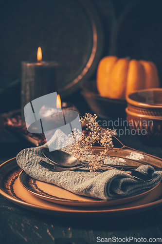 Image of Restaurant autumn table setting. Thanksgiving holiday Place setting autumn decoration.