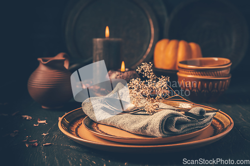 Image of Restaurant autumn table setting. Thanksgiving holiday Place setting autumn decoration.