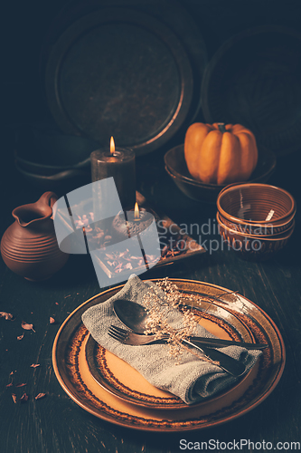 Image of Restaurant autumn table setting. Thanksgiving holiday Place setting autumn decoration.