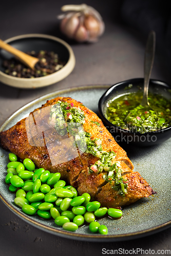 Image of Grilled pork steak with edamame beans and Chimichurri sauce