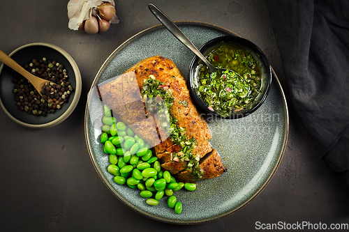 Image of Grilled pork steak with edamame beans and Chimichurri sauce