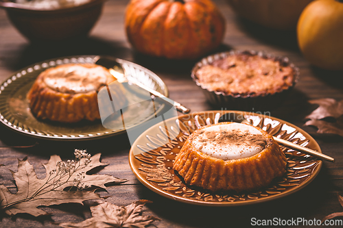 Image of Pumpkin mini pie, tartlet made for Thanksgiving day on old woode