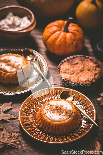 Image of Pumpkin mini pie, tartlet made for Thanksgiving day on old wooden background