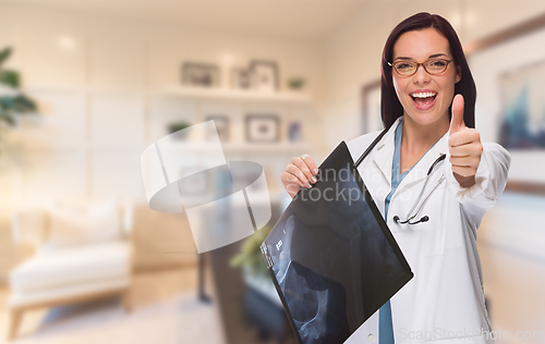 Image of Young Female Doctor or Nurse with Thumbs Up Standing in Office H