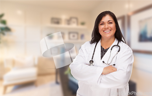 Image of Female Hispanic Doctor or Nurse Standing in Her Office