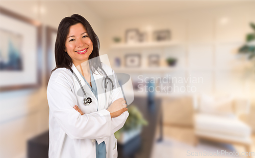 Image of Female Hispanic Doctor or Nurse Standing in Her Office