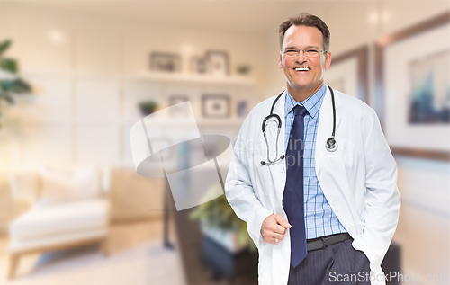 Image of Handsome Doctor or Nurse Standing In His Office